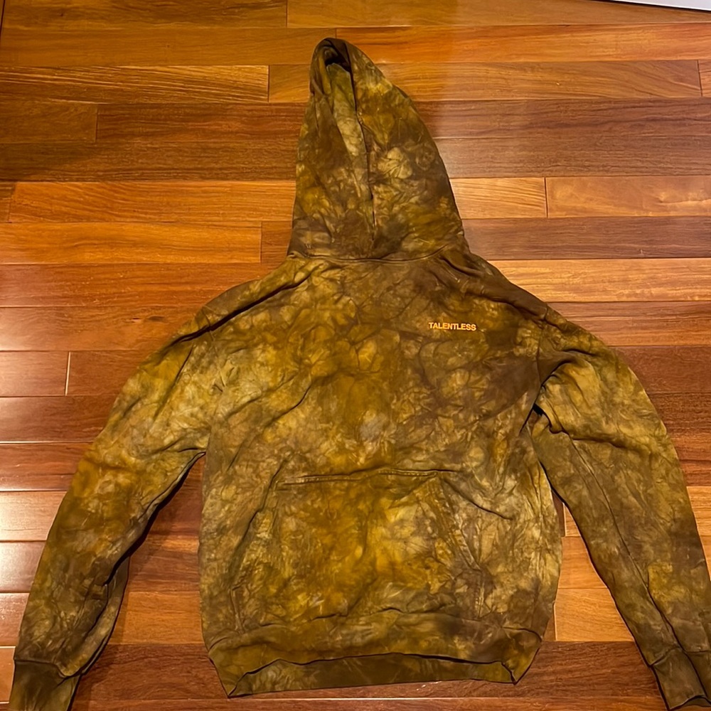 Never worn limited edition TALENTLESS camo wash hoodie with orange lettering.